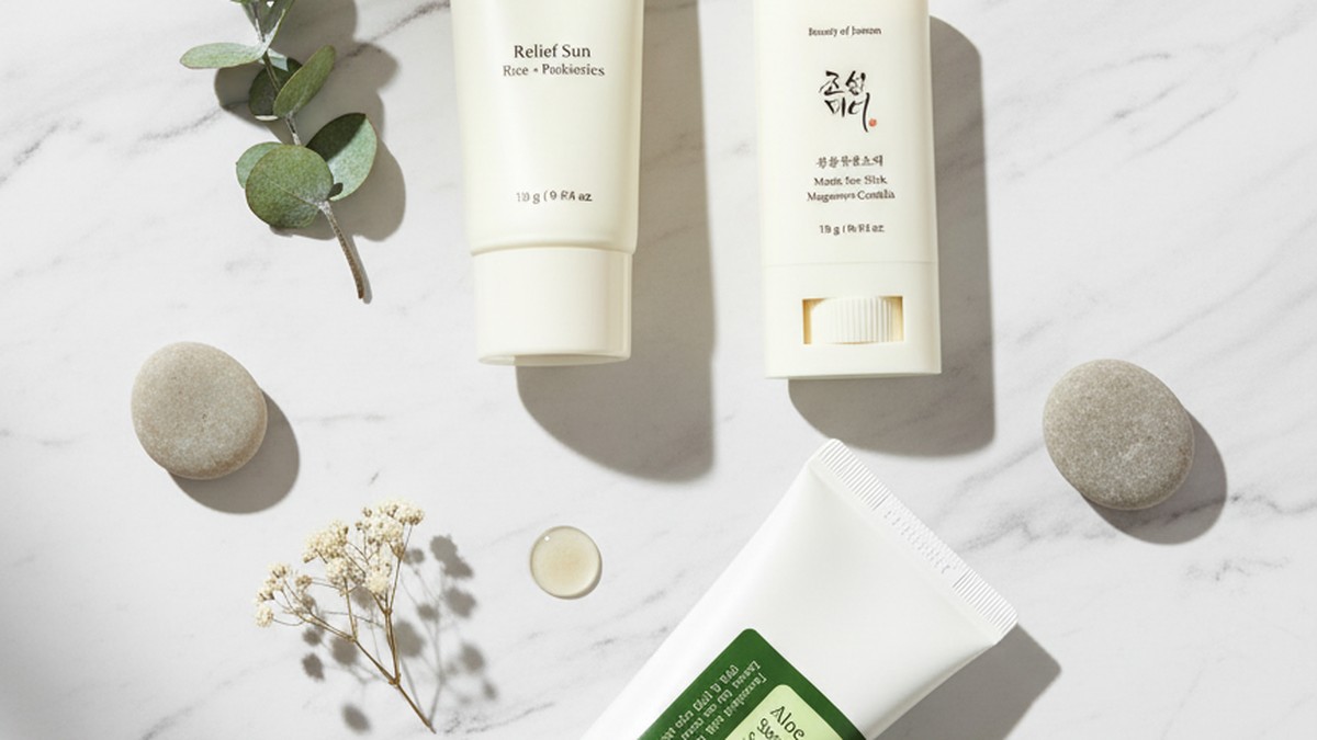 Split composition showing Korean sunscreen tubes on the left and Western sunscreen bottles on the right